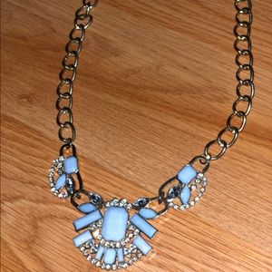 Statement necklace with topaz blue stones.